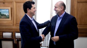 Wado de Pedro y Omar Perotti. Archivo El Litoral